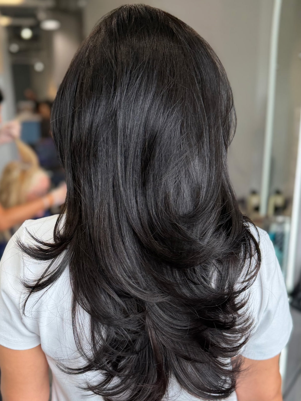 Soft, seamless layered cut with a bouncy blowout by Flo at Salon Sora, Boca Raton