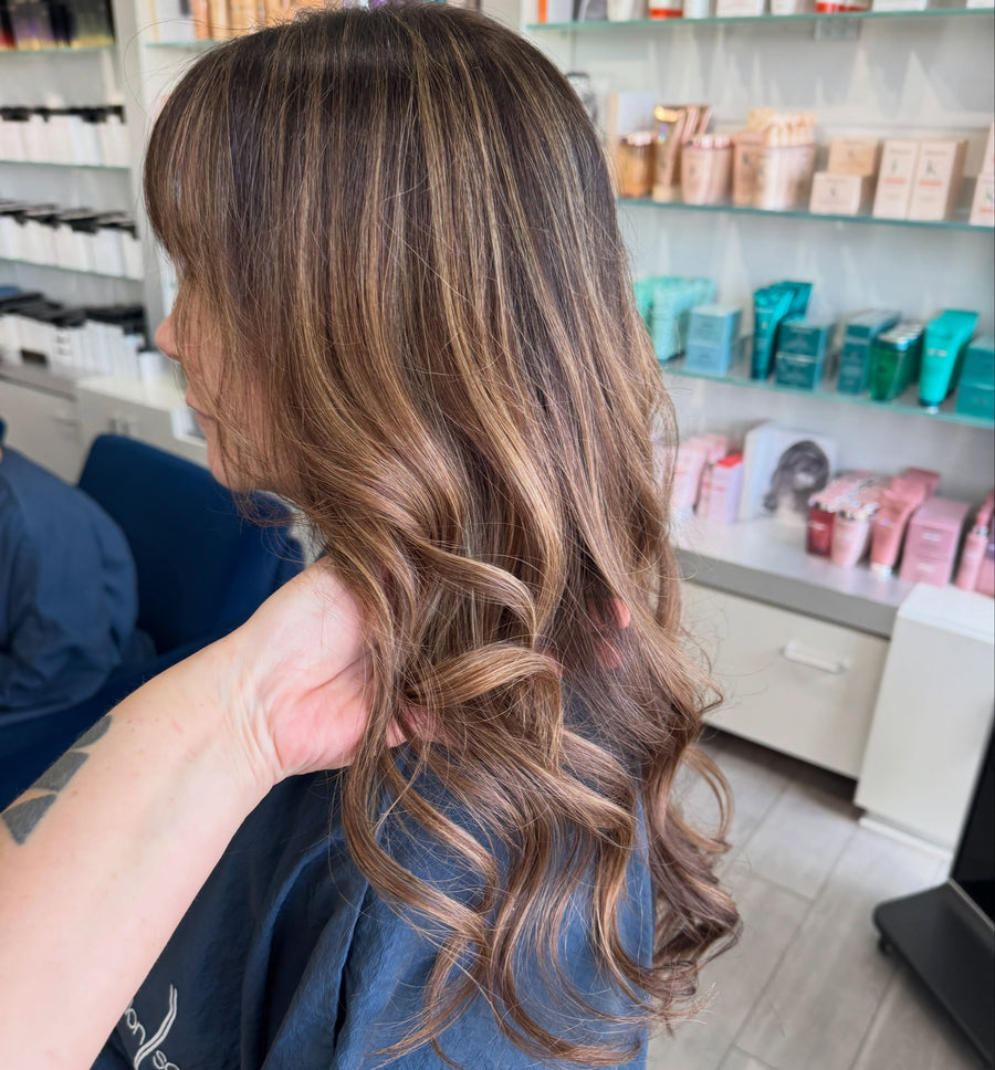 Softened dimensional brunette color that blends grays by Ansley at Salon Sora, Boca Raton